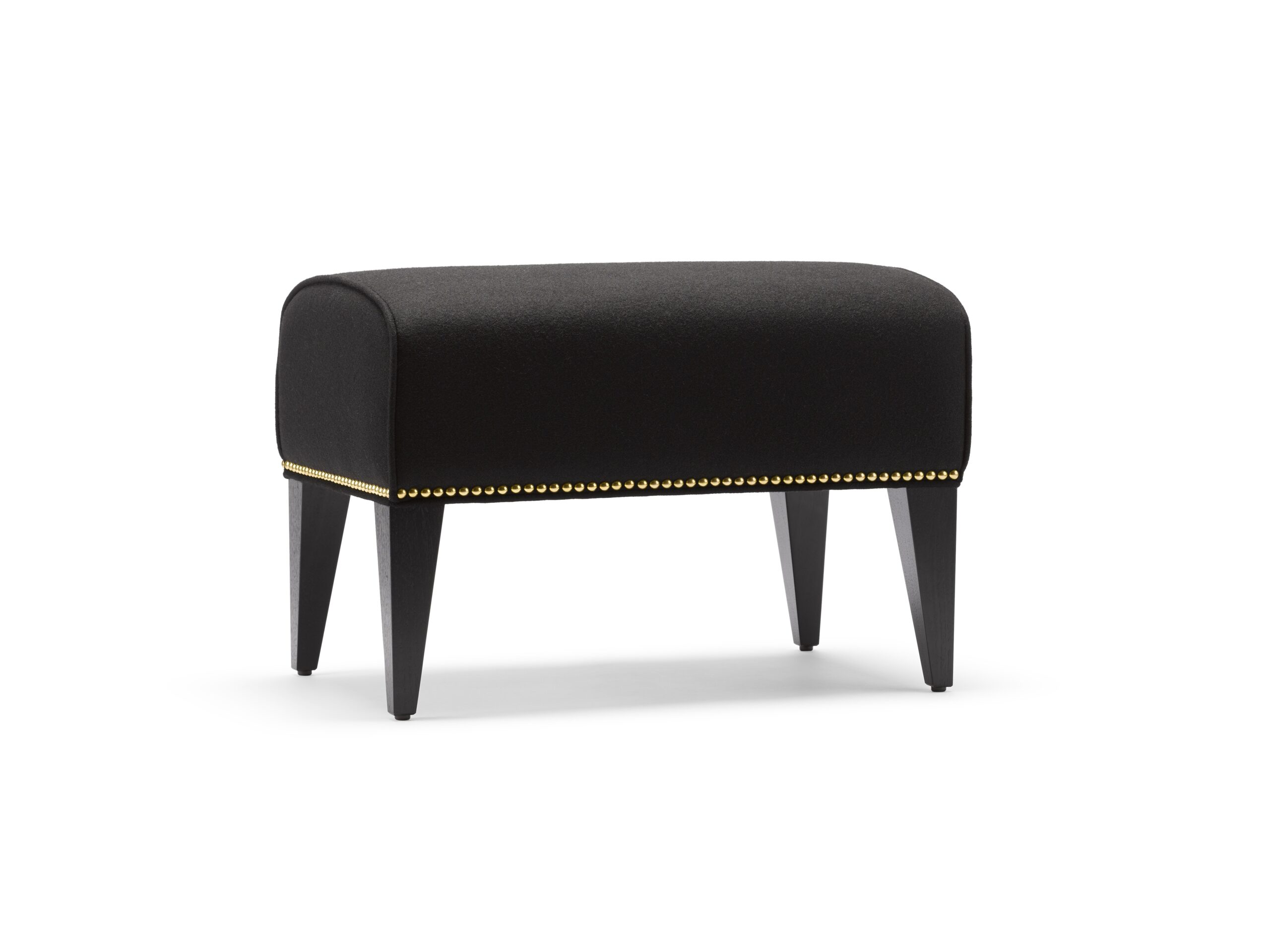 The Alae Footstool, shown with black velvet and decorative nailing.