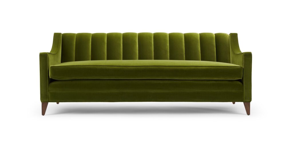 The Fleure Luxus Sofa - Shown here upholstered in Altfield Hanover ‘Henry’ velvet, with legs in natural oiled walnut.