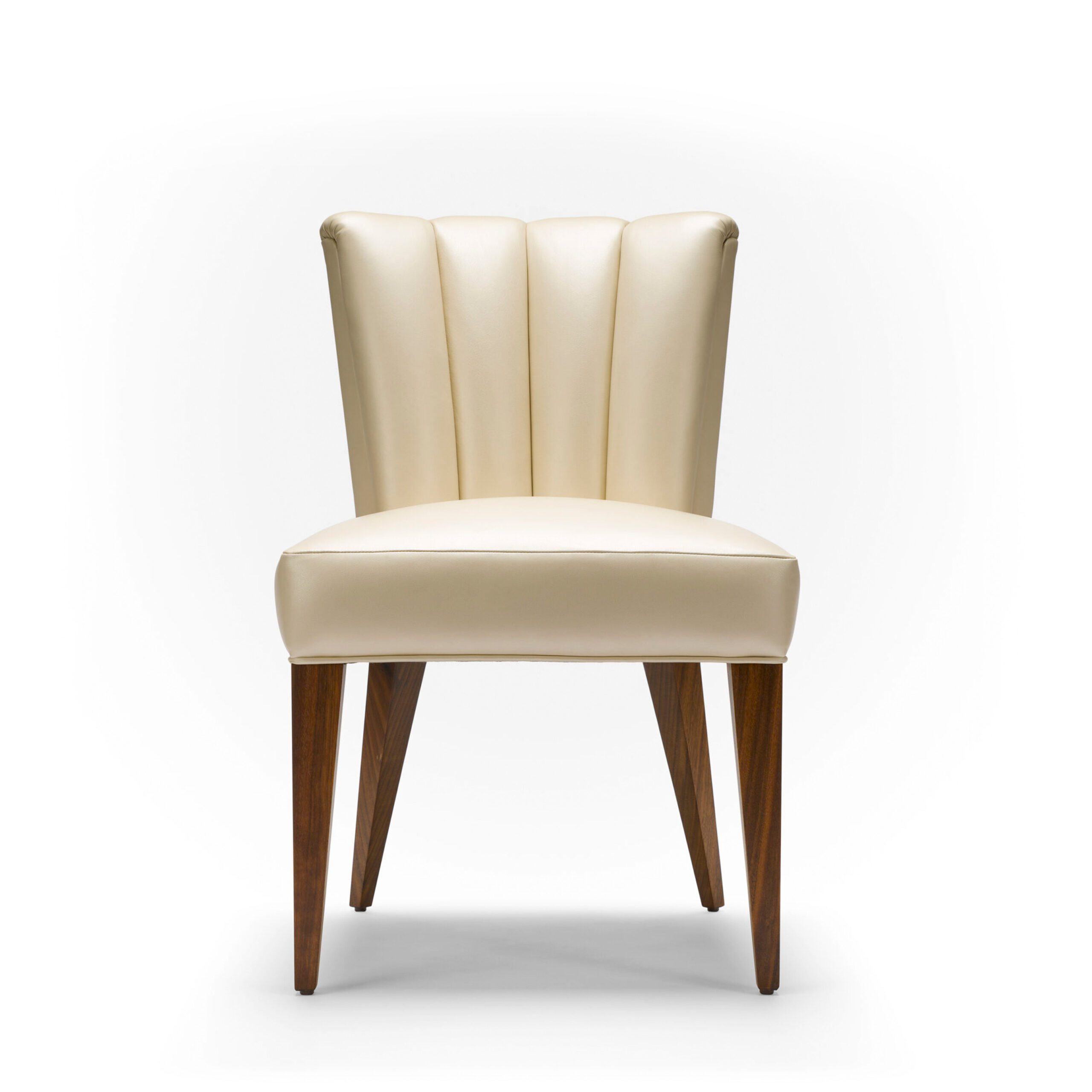 The Elodie Dining Chair - Shown here upholstered in half grain pearlised leather, with natural oiled walnut legs.