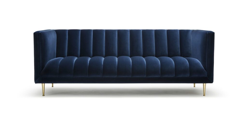 The Fleure Sofa - Shown here upholstered in Alessandro Bini cotton velvet, with legs in machine turned solid brass.