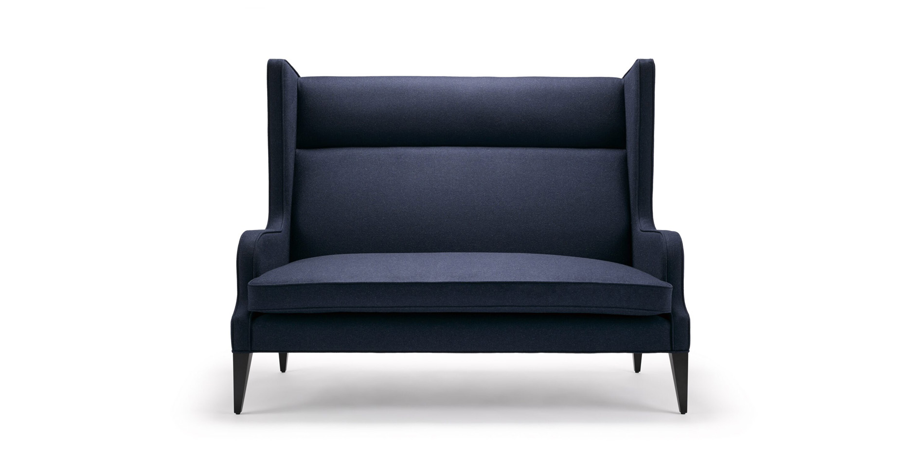 Alae Wing Sofa - Shown here upholstered in Casamance Arthur’s Seat navy wool, with legs in black lacquered walnut.