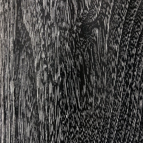 Ebony black wood with a limed white wash in the grain of the wood.
